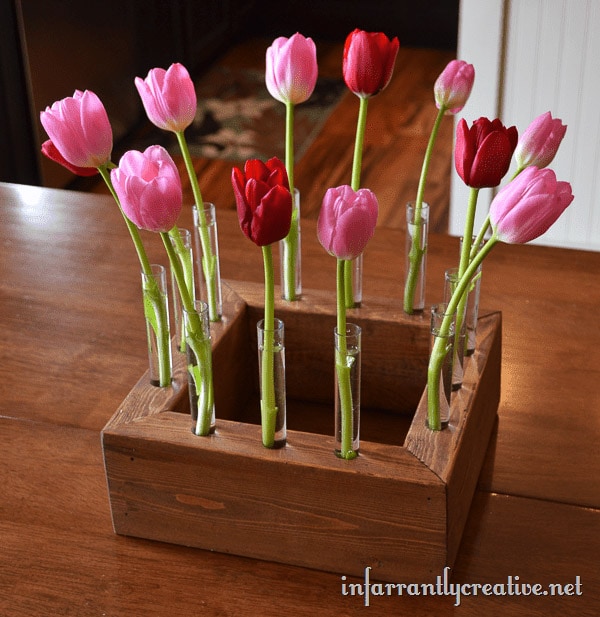 Square floral centerpiece with test tubes and tulips