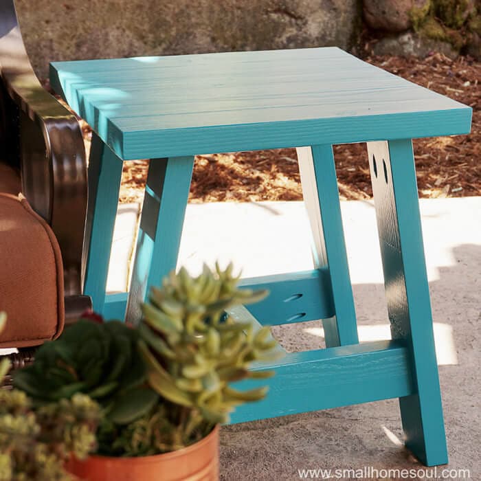 Simple blue outdoor side table made from 2x4 wood