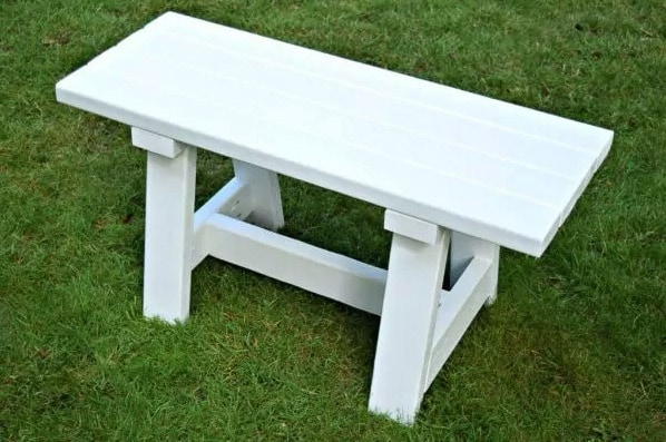 small white DIY farmhouse bench using 2x4 boards