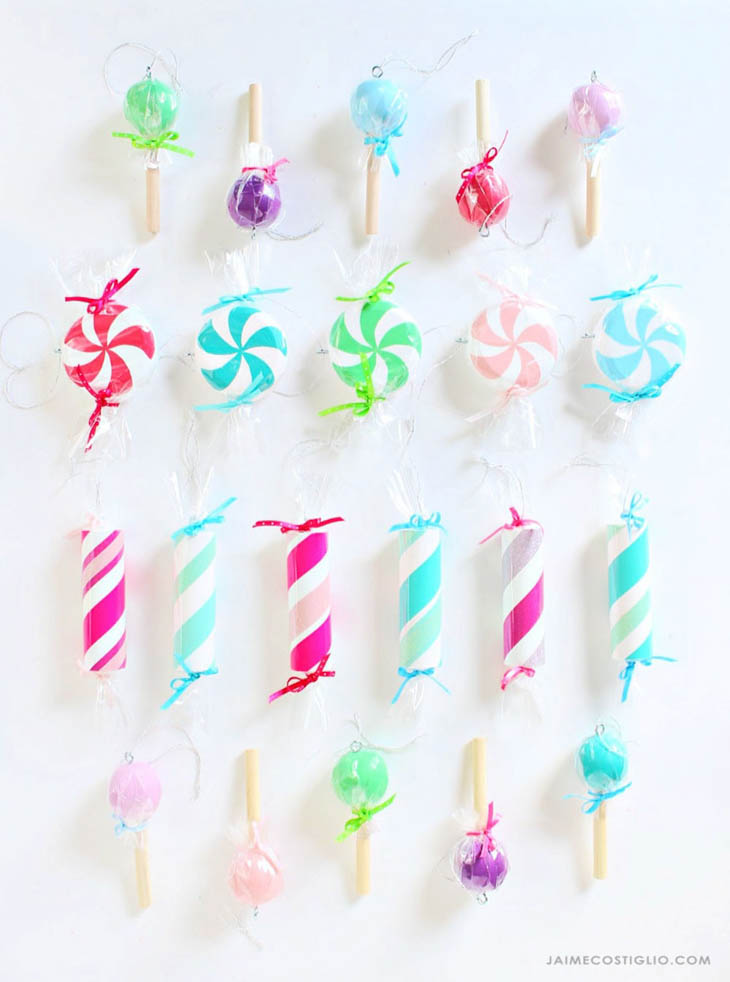 candy ornaments made from scrap dowels in bright pink, blue and green