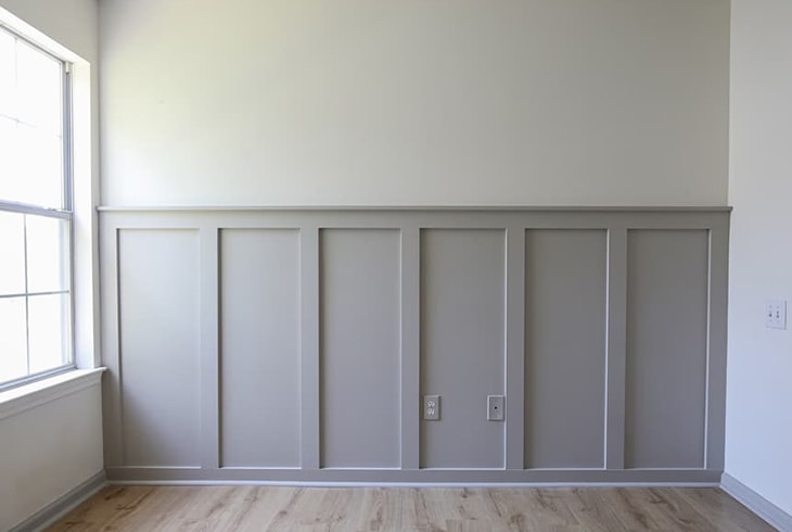 Simple gray board and batten across a wall 
