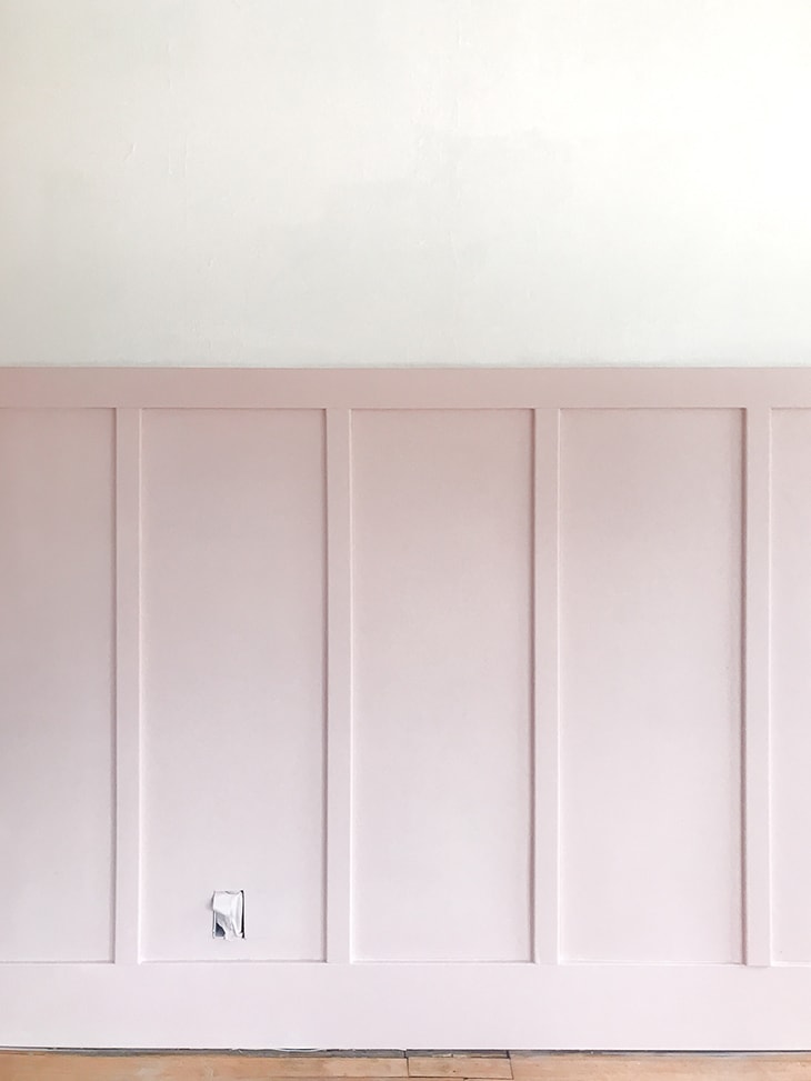 pink board and batten wall in an empty room