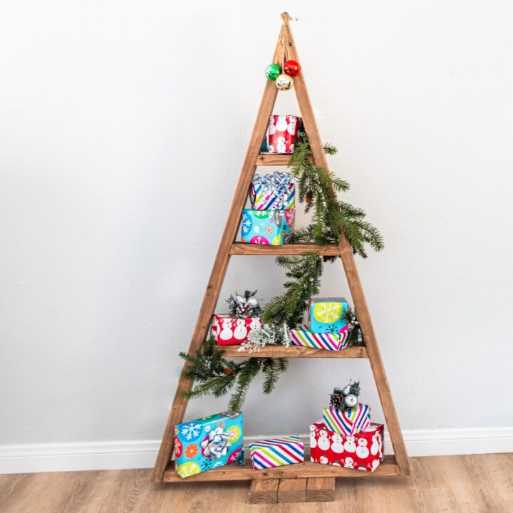 Christmas tree shelf with presents and greenery