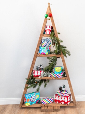 Learn how to build an easy DIY Christmas tree shelf in a couple of hours with this simple step-by-step tutorial.