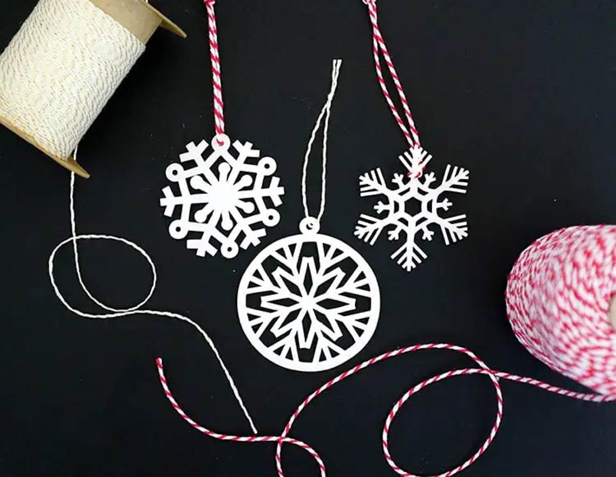 Three styles of snowflake ornaments made with Cricut