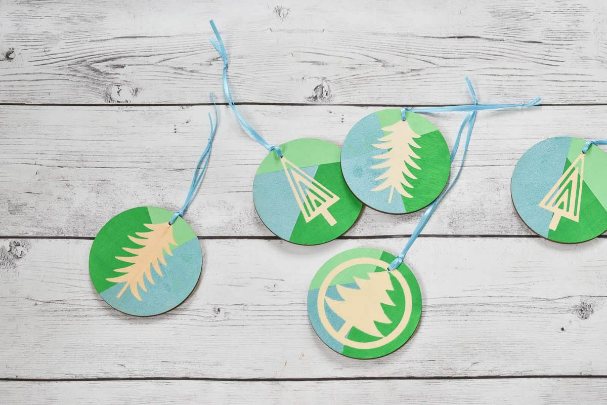Blue and green color blocked ornaments with Christmas tree stencils
