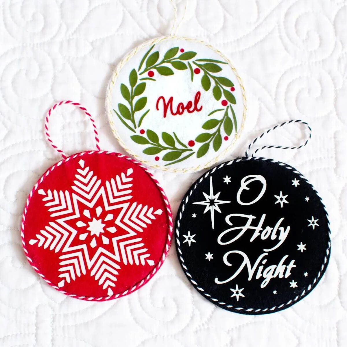 Three felt ornaments made with Cricut