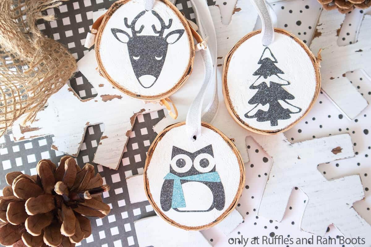 Wood slice Cricut Christmas ornaments with woodland animals