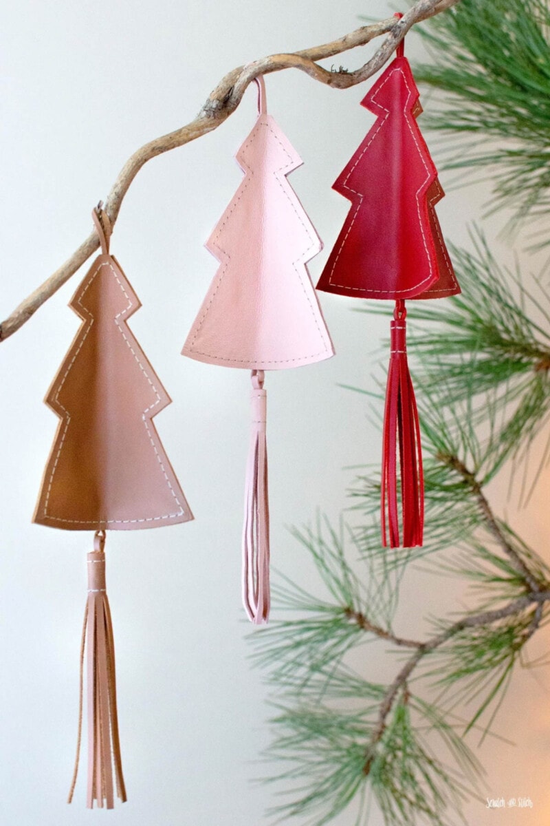 Three leather Christmas tree ornaments with tassels