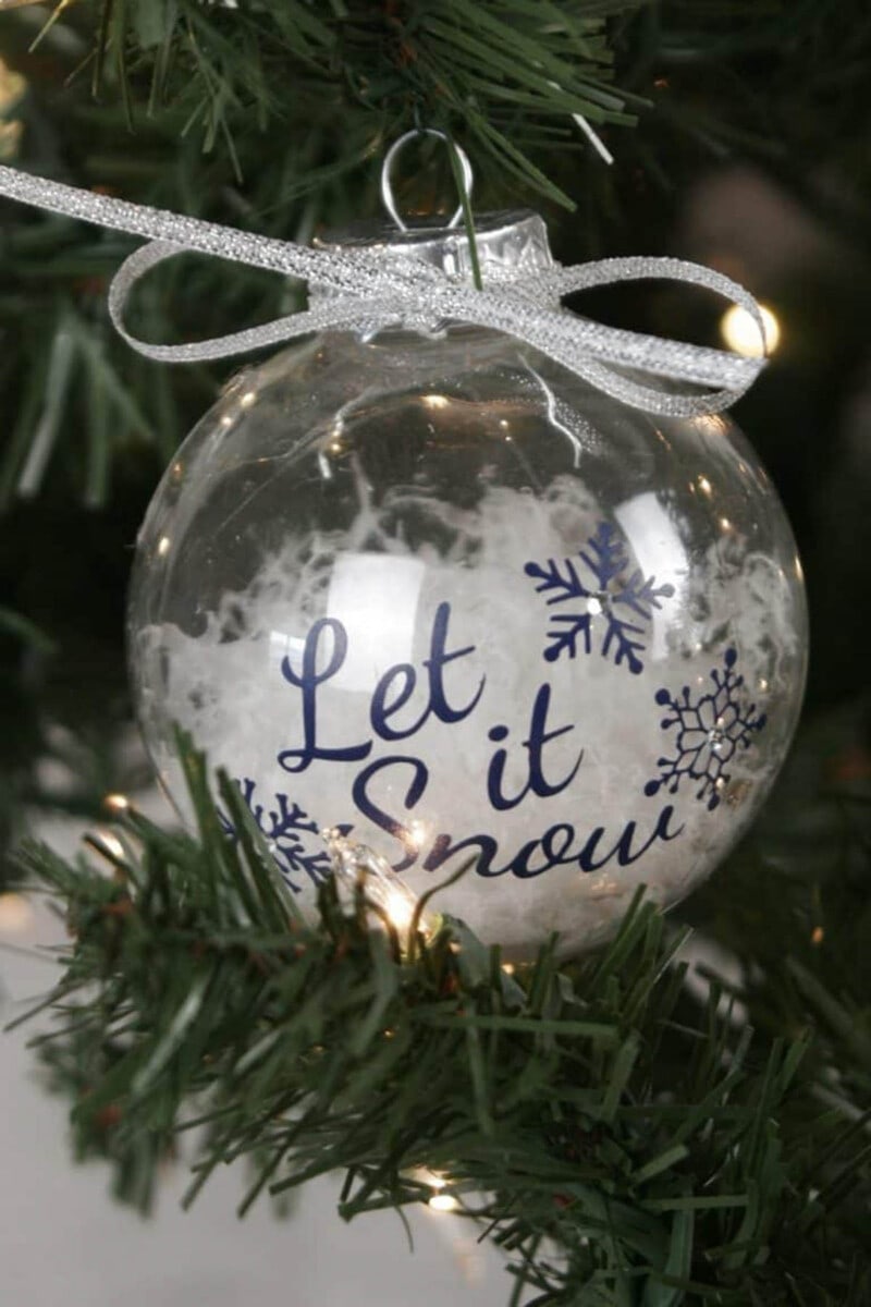 Clear ball ornament with "Let it snow" in vinyl letters