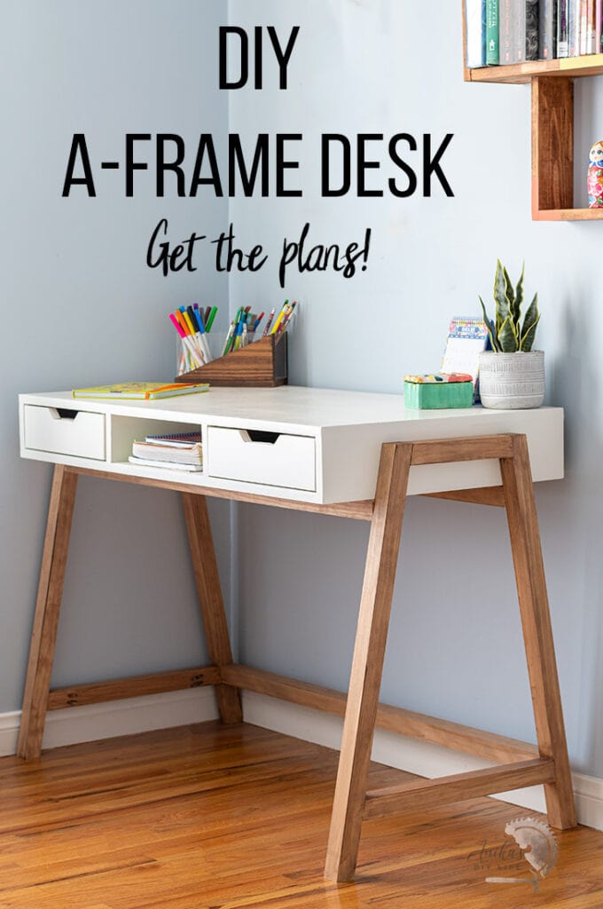 DIY A-frame desk in room with accessories on top.