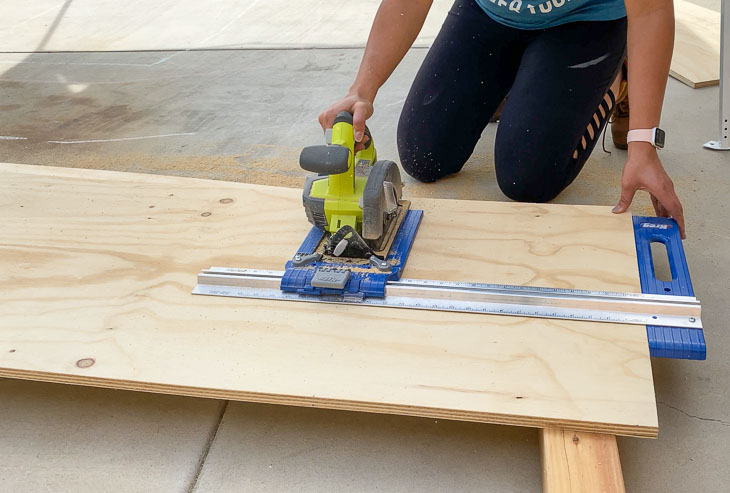 cutting plywood to make the DIY desk
