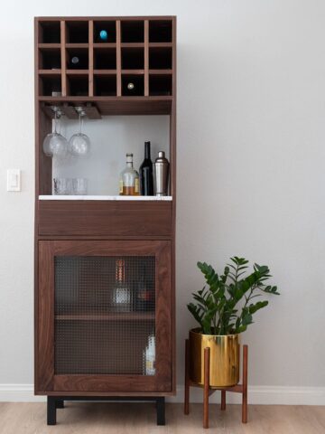 Learn how to build a DIY tall bar cabinet with drawer, wine rack, and wine glass holder with detailed plans. Perfect for small spaces.