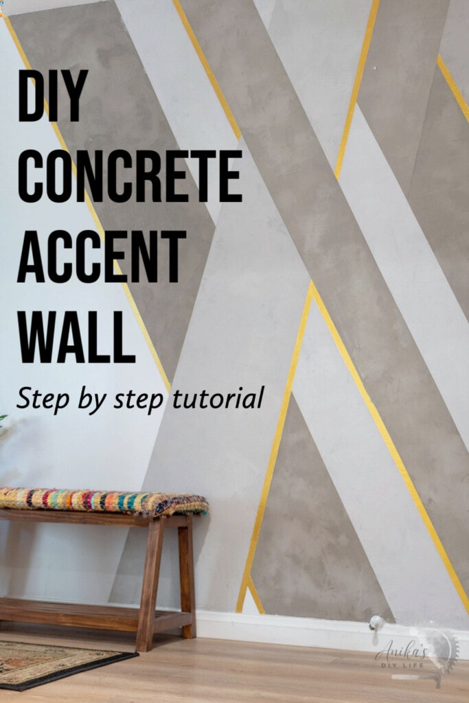 DIY Cement accent wall with gold accents in an entryway