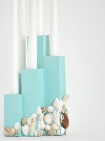 This DIY coastal candle holder brings the right touch of beach to your decor and makes a great centerpiece!