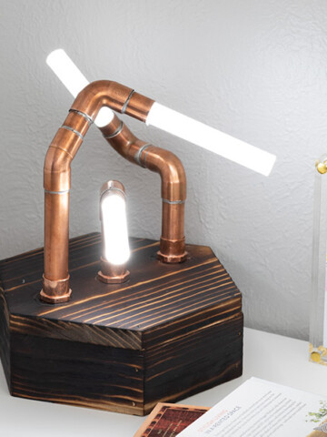Make a modern industrial DIY copper pipe LED lamp with glowing acrylic rods. Learn all the steps and details you need to know to make this fun project!
