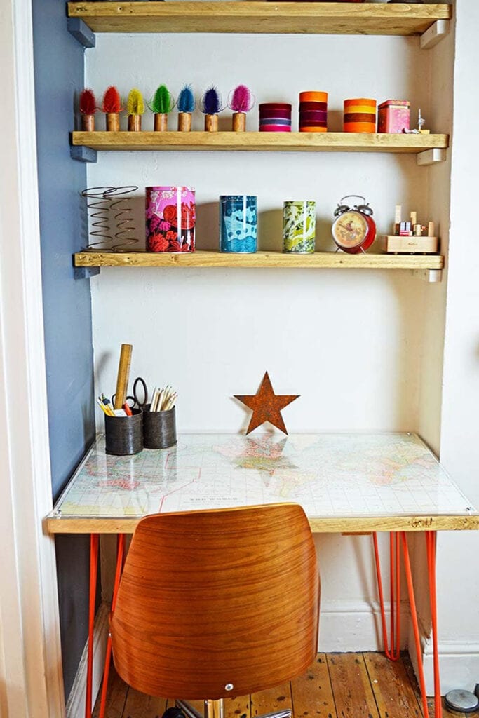 DIY desk with red hairpin legs and world map on the top