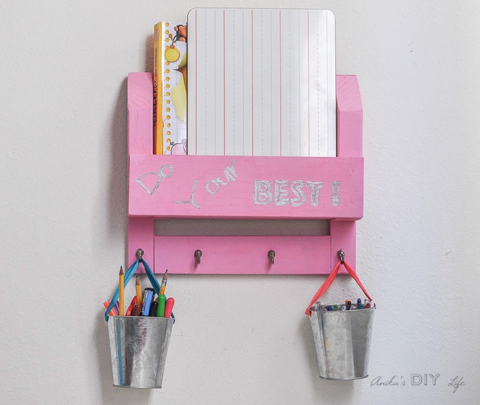 Easy DIY homework organizer on wall with books and pens