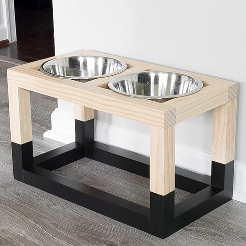 Learn how to build a DIY raised dog bowl stand with a simple and modern design.