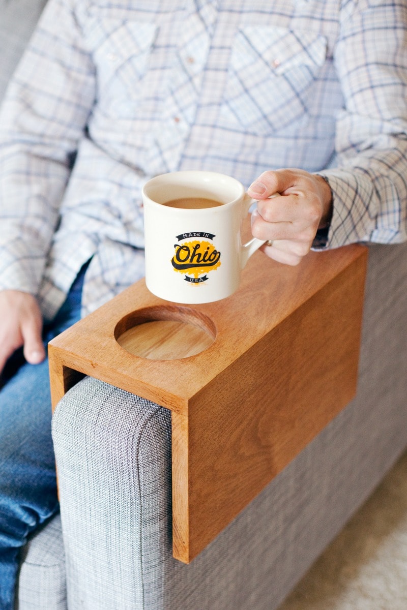 man holding a cup of coffee above wooden couch sleeve drink holder DIY gift for him