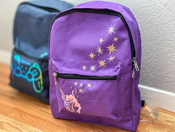 blue and purple kids backpacks with iron on custom designs