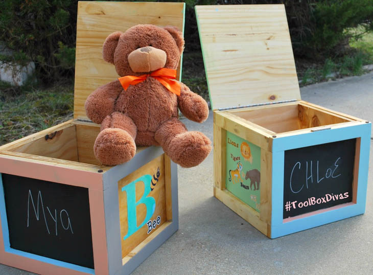 DIY wood kids storage boxes with alphabet letters painted on them and a teddy bear sitting on one
