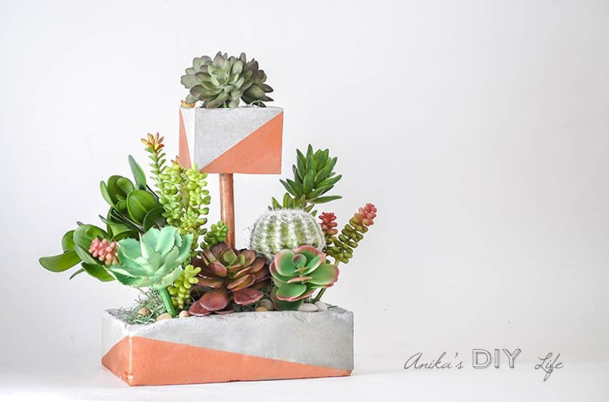 Two tiered concrete planter with copper accents makes a great DIY gift for plant lovers