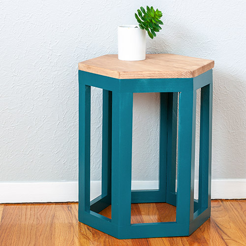 Learn how to build a DIY hexagon end table using a single 8 foot 1x10 board with step by step plans & video tutorial. OR build it using 1x2s - your choice!