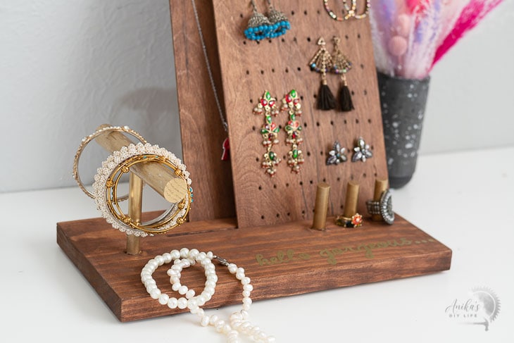 close up of the DIY jewelry stand with jewelry on it.