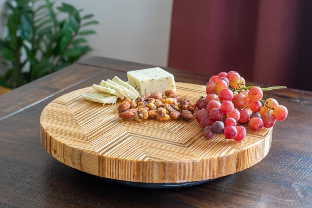 Chevron patterned plywood lazy susan on table
