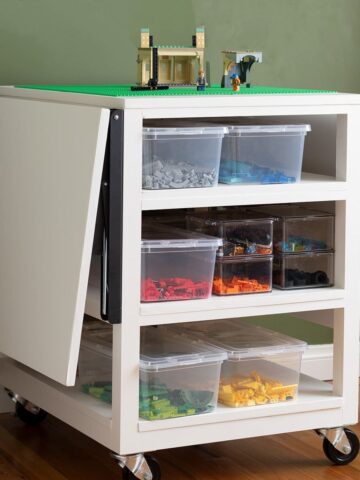 Learn how to make a DIY Lego Table with Storage and folding sides with the detailed tutorial and plans. This table is perfect for small spaces.