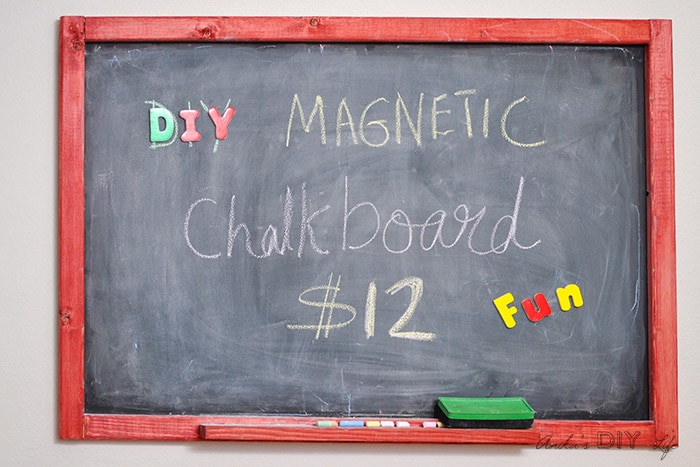 DIY magnetic chalkboard with red frame and characters written on it. 