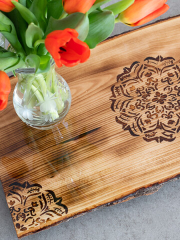 Learn how to make a gorgeous DIY Mandala Tray using wood burning with a heat-sensitive pen and blowtorch. Its a quick project and takes a couple of hours!