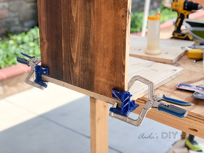 Using corner clamps to assemble a box for the nightstand