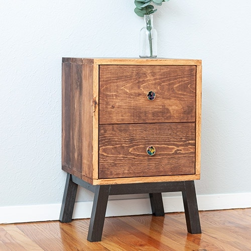 Learn how to make an easy DIY nightstand with drawers. A simple design perfect for beginners and looks like designer furniture! I have you covered with the full tutorial, plans and video!