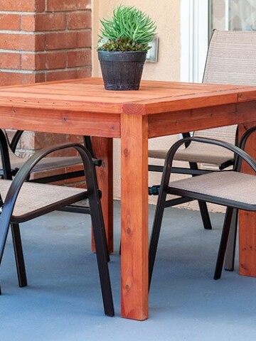 Learn how to make a simple DIY outdoor dining table with full plans, tutorial, and video. This DIY Outdoor table uses only structural 2x4 and 2x6 lumber and costs $20!