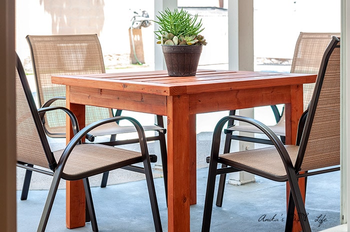 A Simple DIY outdoor dininh table in patio with 4 chairs