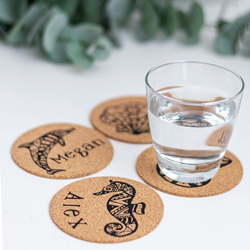 Learn how to make personalized cork coasters using iron on or heat transfer vinyl. This is a quick and easy DIY hostess gift idea using a Cricut machine.