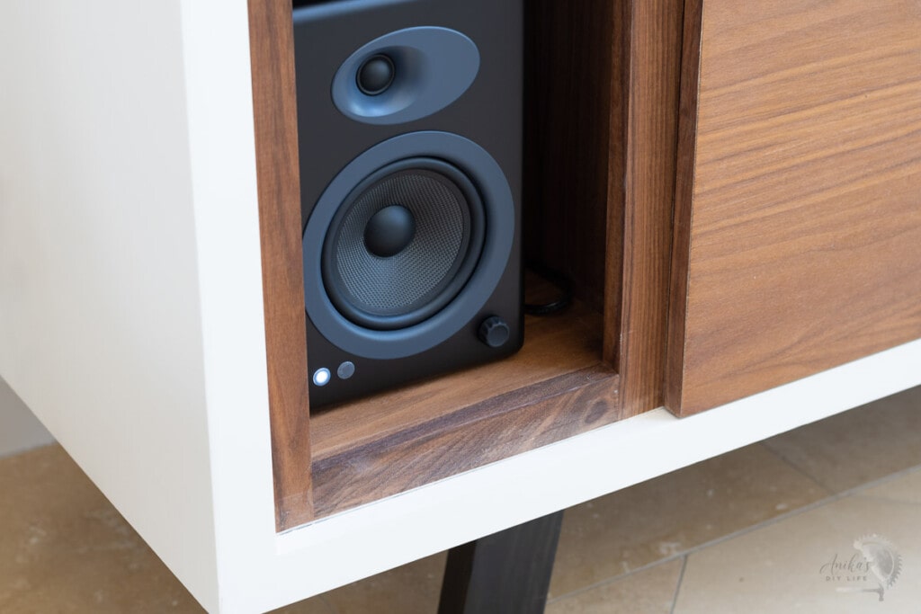 Close up of the speaker compartment of the record player cabinet