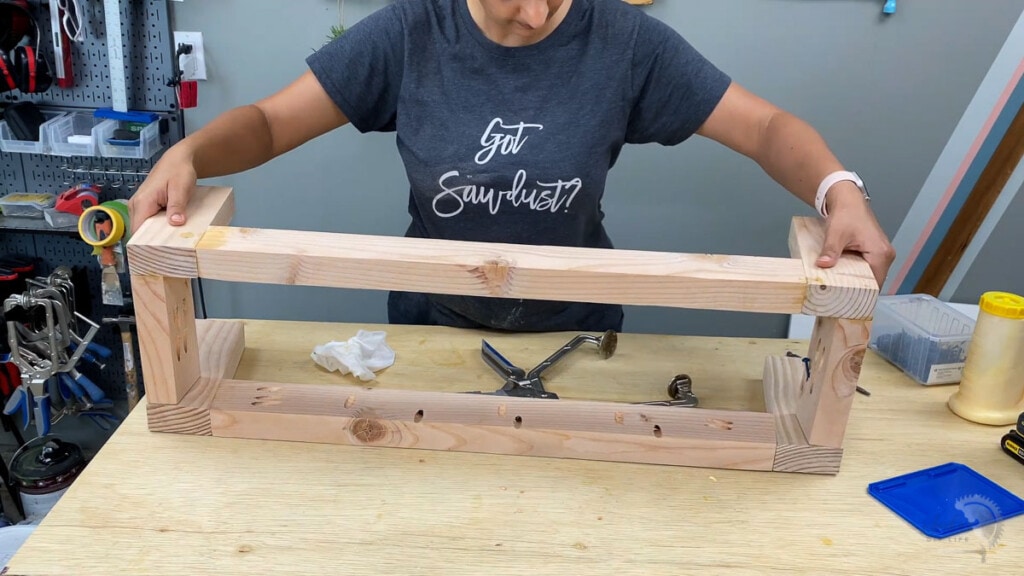 Woman building the stand for the turntable console