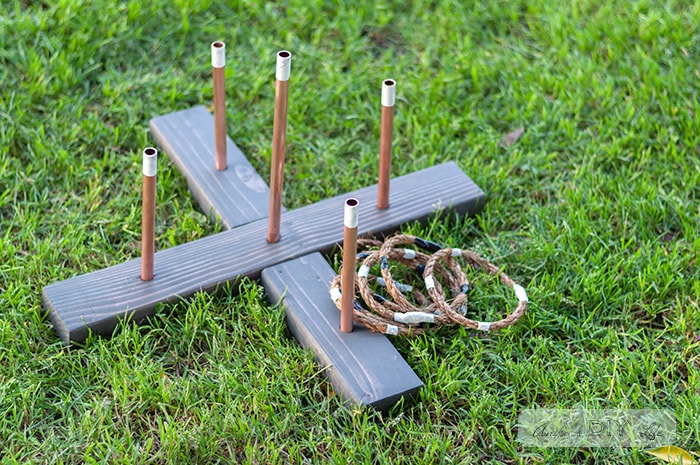 DIY Ring toss game in the grass with the rope rings