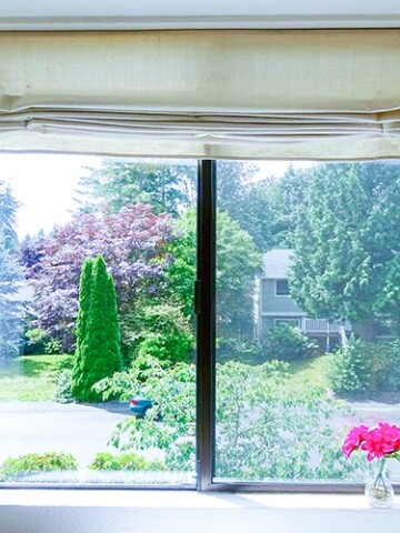 DIY Roman shades are a super inexpensive way to make your own stylish window coverings and create privacy.  This tutorial walks you through exactly how to make this using drop cloth!! 