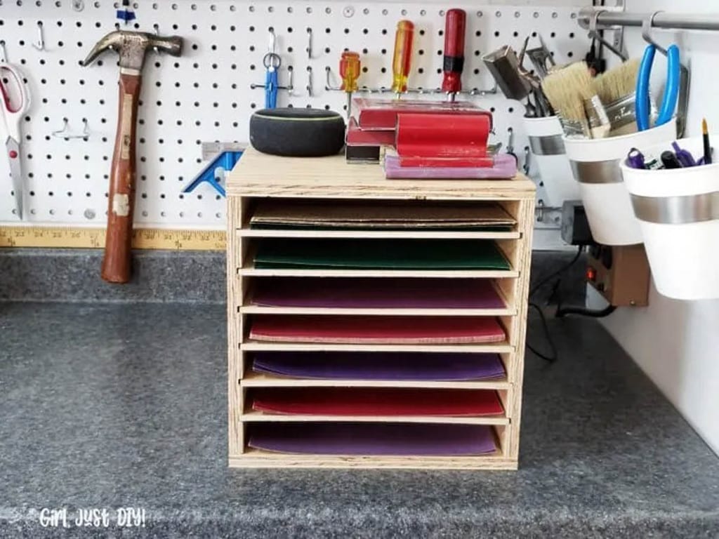 sandpaper storage rack sitting on a workbench