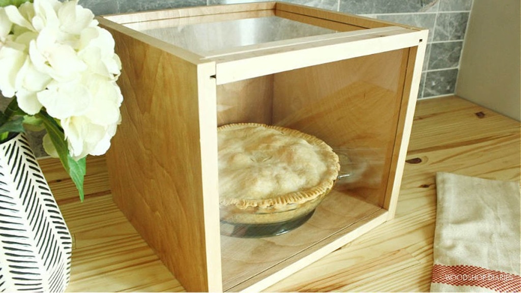 pie box made from scrap plywood and plexiglass with a pie sitting inside
