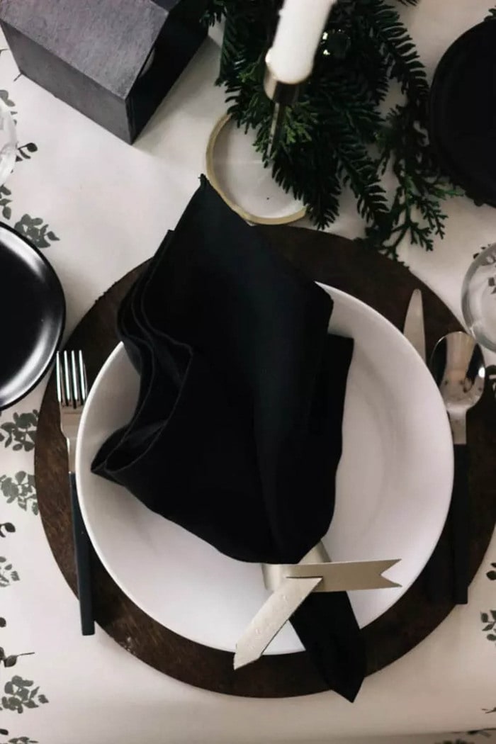 table setting using scrap plywood chargers painted black