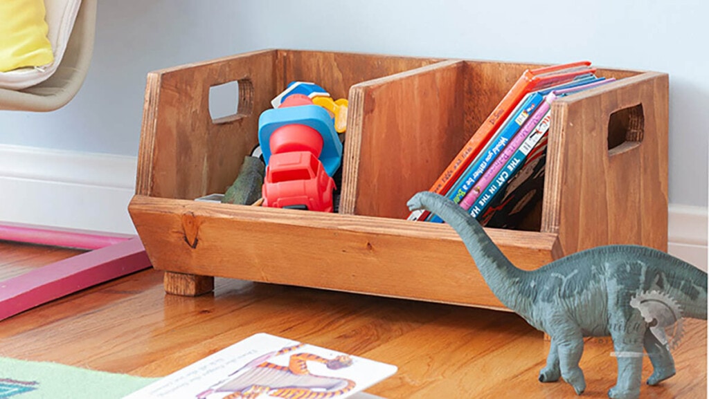 divided storage bin made from scrap plywood used for toys and books