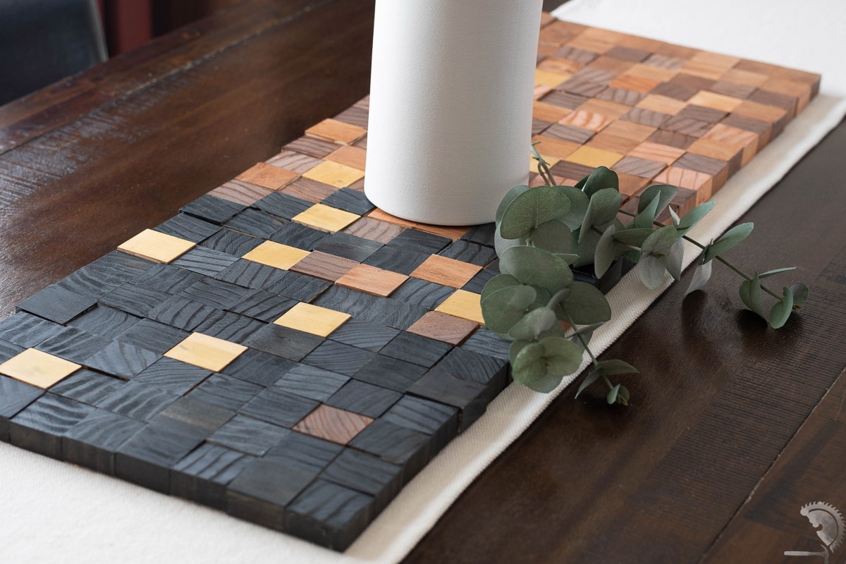 wood block table runner on table with greenery
