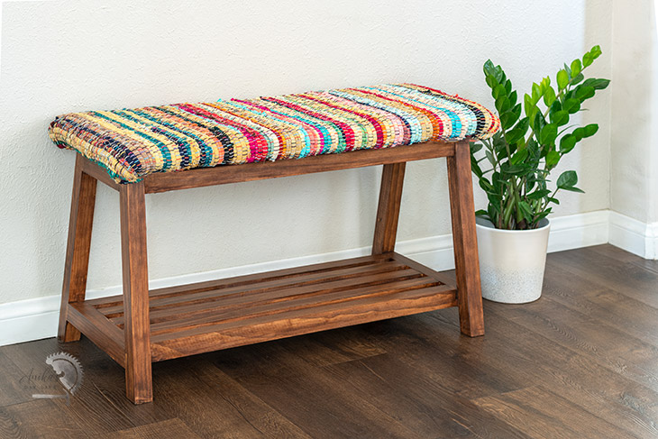 DIY upholstered bench with colorful fabric in room