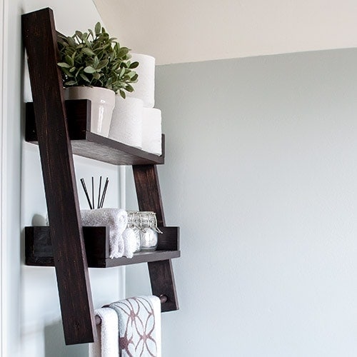 A DIY floating ladder shelf that fits in perfectly with any decor or room. Combine DIY floating shelves and DIY ladder shelves to create this unique open shelf. The step by step plans show you how to build this perfect alternative to simple open shelves.