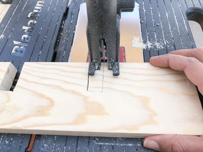 Cutting slots in the boards to make the DIY spice rack